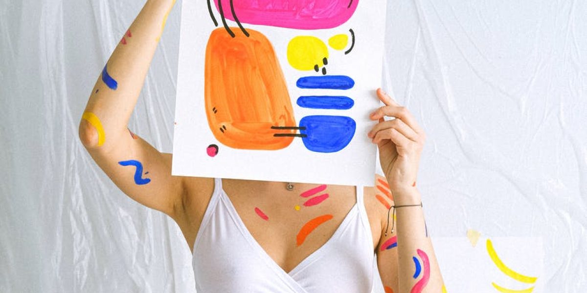 photo of woman holding paint work